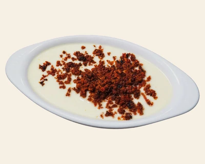 Chori queso: white cheese dip topped with crumbled chorizo