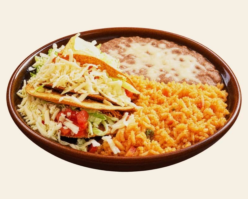 Hard shell tacos with rice and refried beans