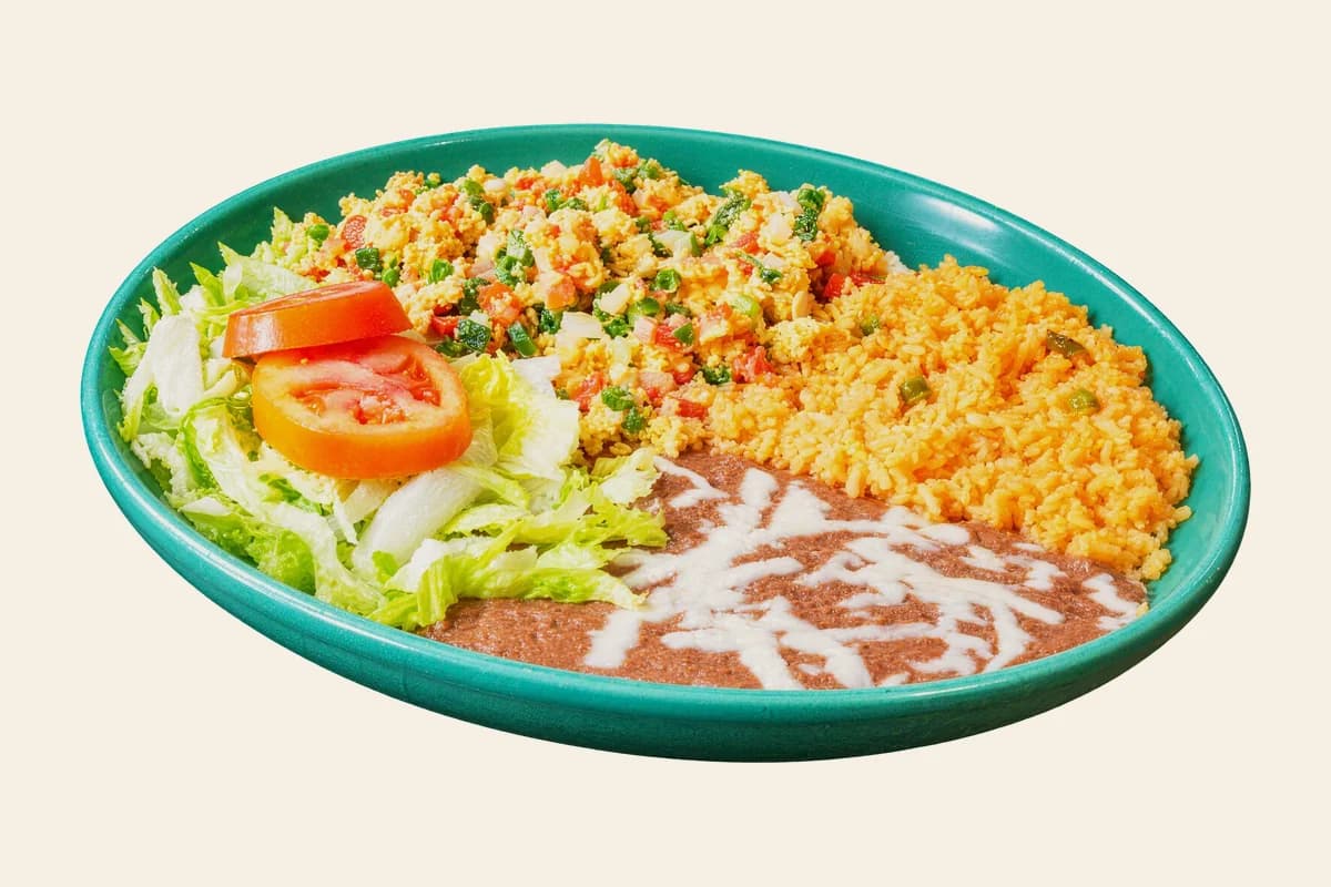 Huevos a la mexicana with Mexican rice, refried beans and salad