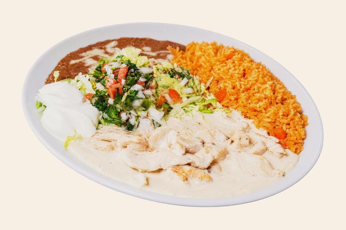 Pollo a la crema with Mexican rice, refried beans and pico de gallo