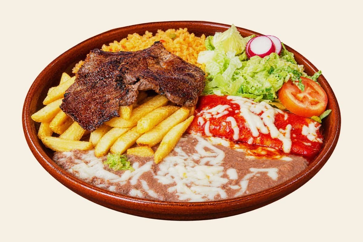 Tampiqueña plate: grilled steak, a red enchilada, french fries, refried beans, lettuce and tomato