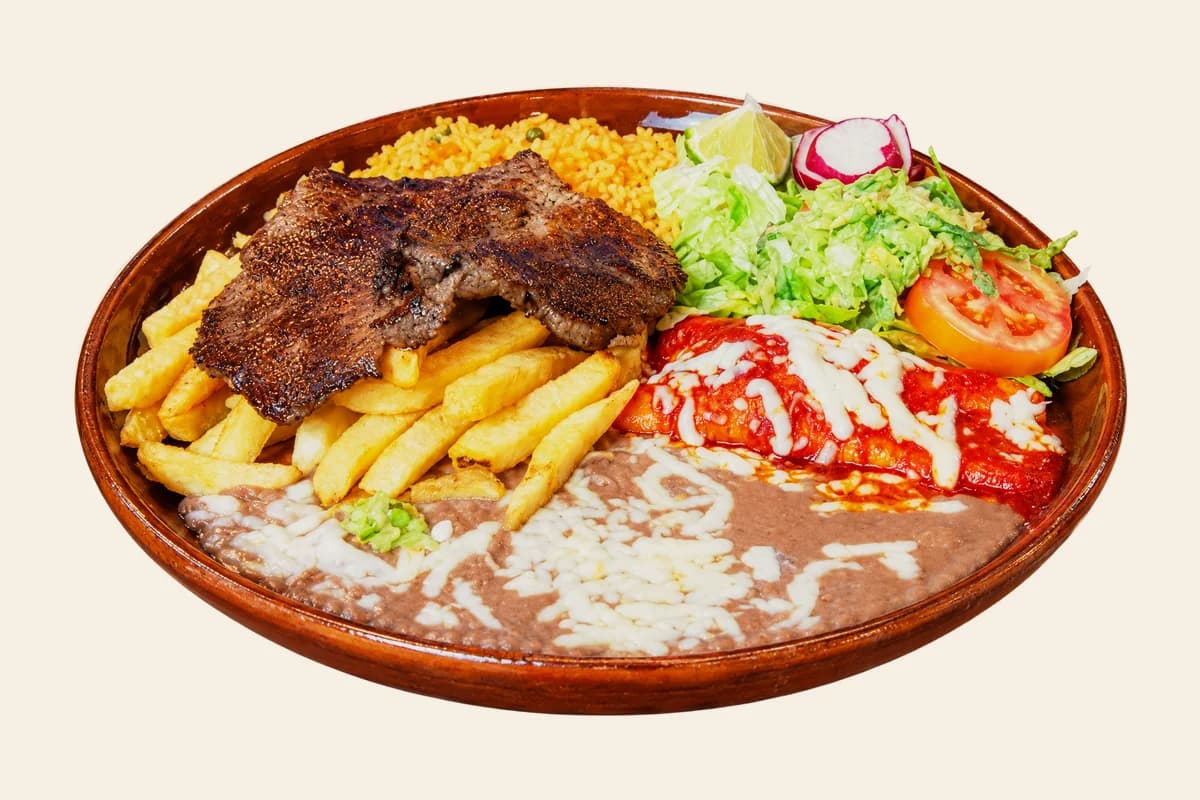 Tampiqueña: grilled steak with a red enchilada, french fries, refried beans, lettuce and radish